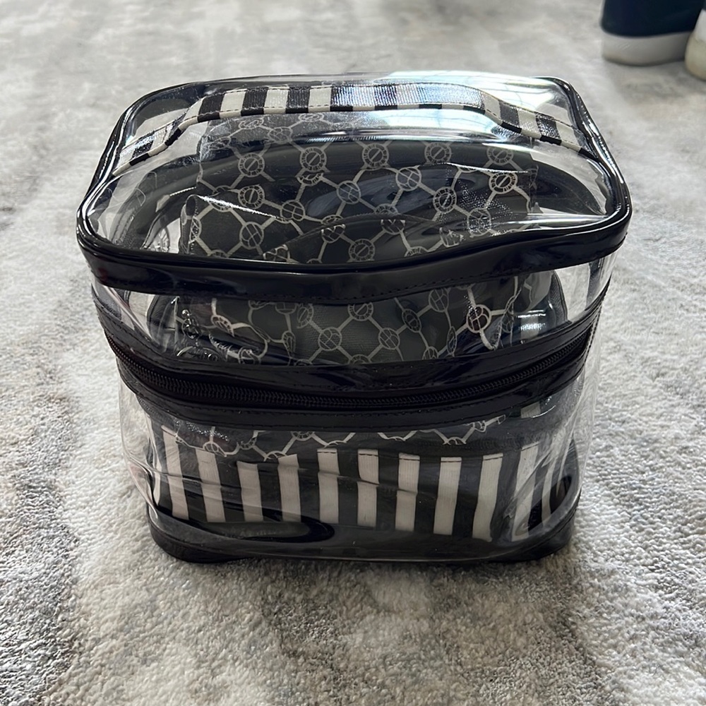 Henry Bendel 4 piece cosmetic bags (never used)